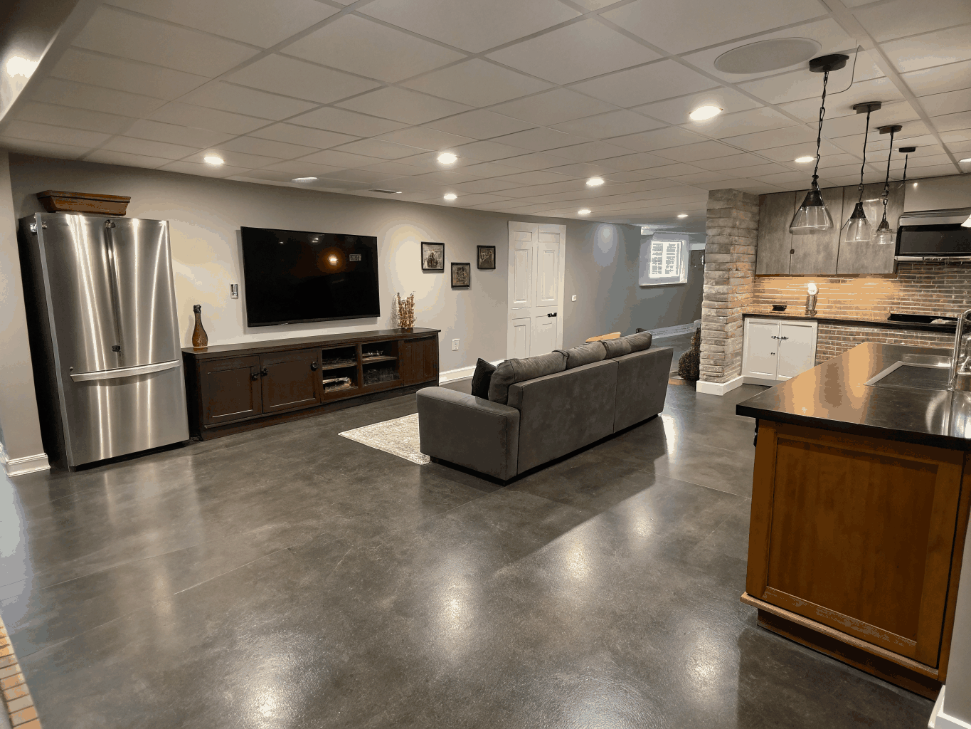 Daylight walkout finished basement suite with custom wet bar and wine cellar millwork