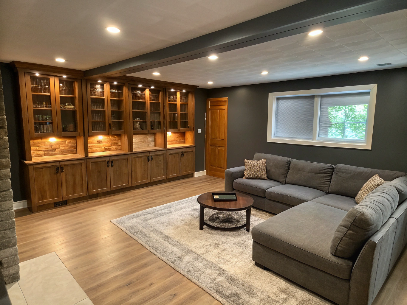 Finished walkout basement with a lounge area and large windows